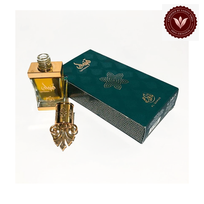 Al Qamar Qinwan 12ml box and attar bottle with Vanity Vibes badge