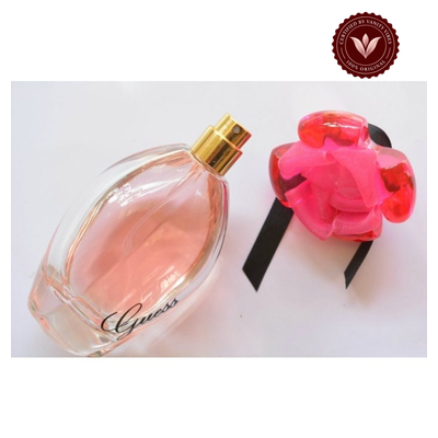 Guess Girl EDT 100ml angled bottle and flower cap view with Vanity Vibes badge